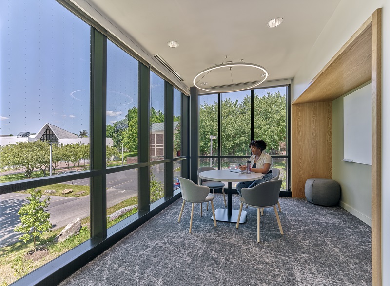 Woman studying in Fahy Commons